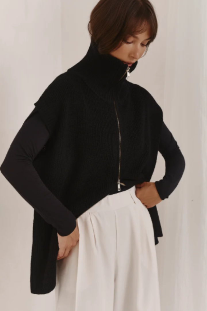 Millie Vest in Black by Charli London — pairs well with tailoring or straight-leg denim.