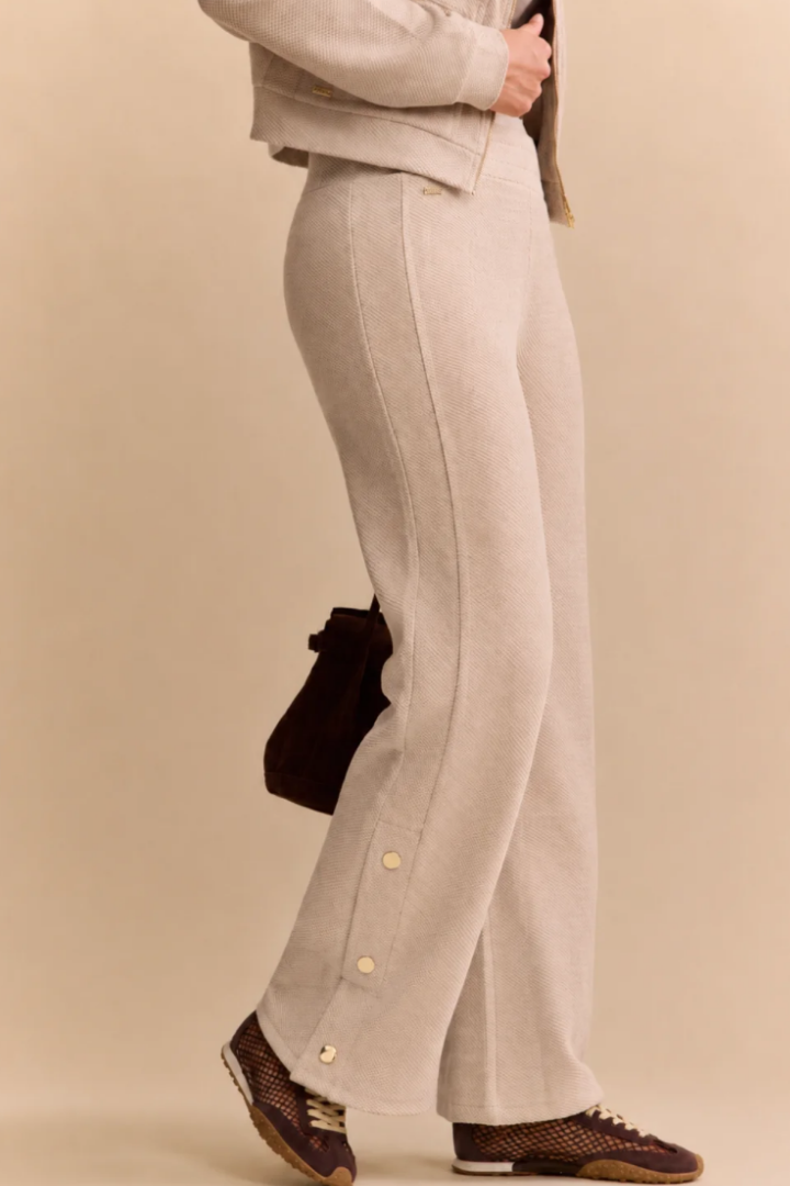 Lune Active Moon Pant in Beige — relaxed jogger finished with gold buttons along the outer hems.