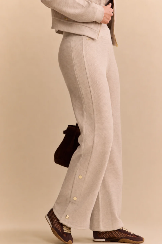 Lune Active Moon Pant in Beige — relaxed jogger finished with gold buttons along the outer hems.
