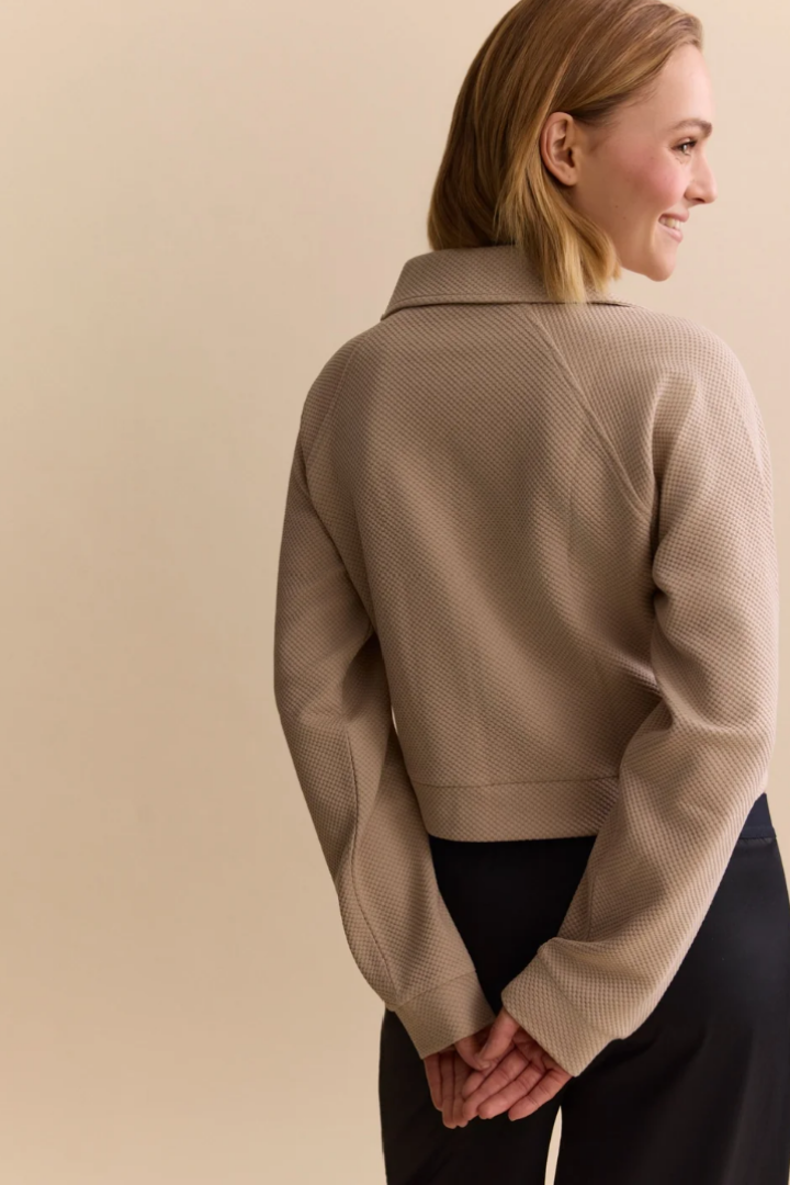Lune Active Moon Short Jacket in Beige — polished layer featuring gold hardware detail.