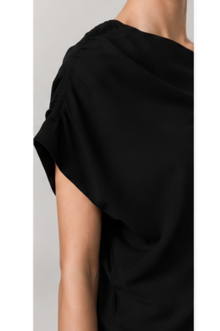 Birgitte Herskind Brenda Top in Black — a striking, minimal finish with a single exposed shoulder.